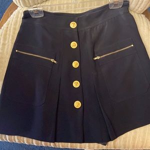 Black skirt with lion buttons and zipper pockets
